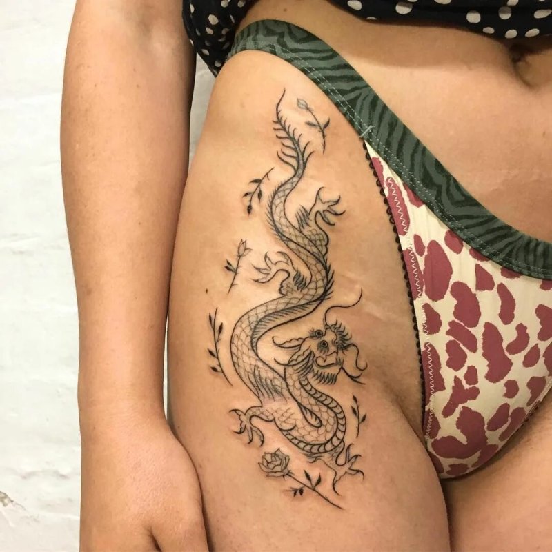 Тату на бедре для девушек дракон