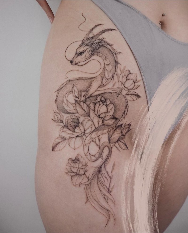 Тату на бедре дракон