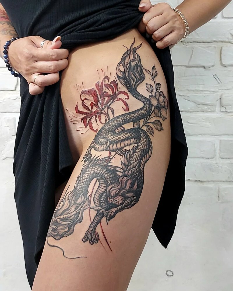 Тату дракона на бедре для девушек