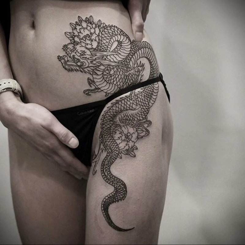Тату дракона на бедре для девушек