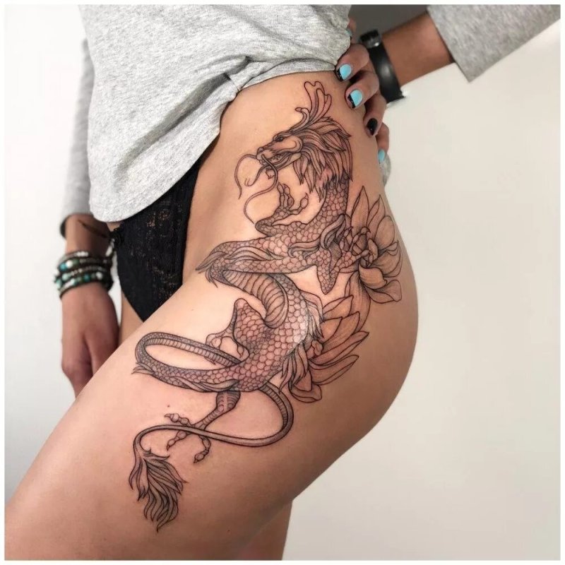 Тату на бедре для девушек дракон